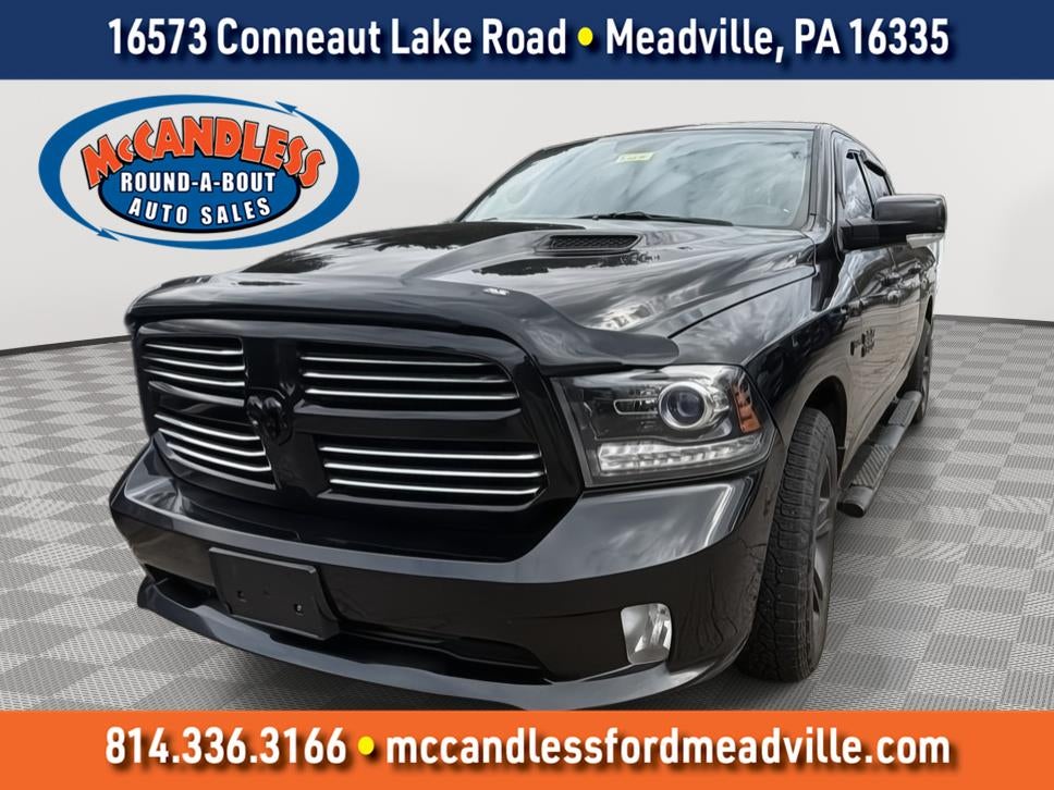 2016 RAM 1500 Sport in Brilliant Black Crystal Pearlcoat — front three-quarter view